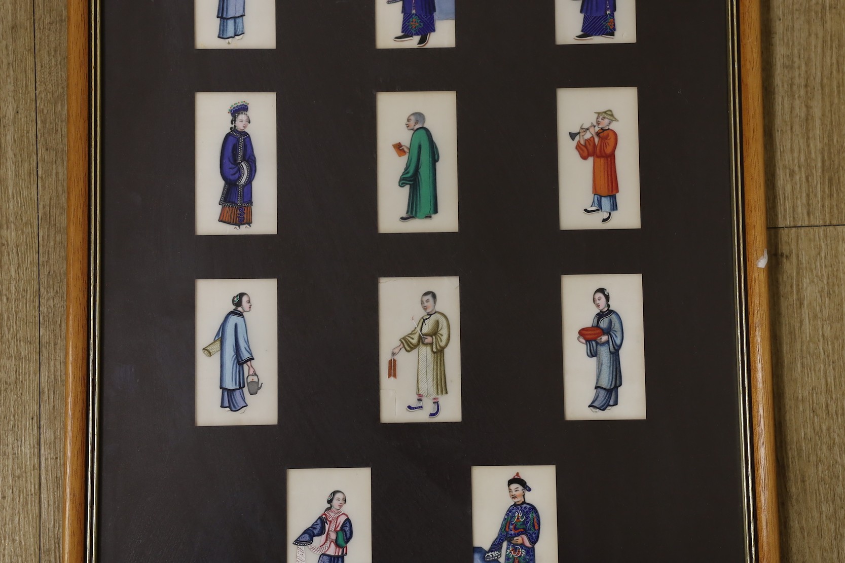 19th century Chinese School, seventeen gouaches on pith paper, Figure studies, 9 x 4.5cm, framed as one